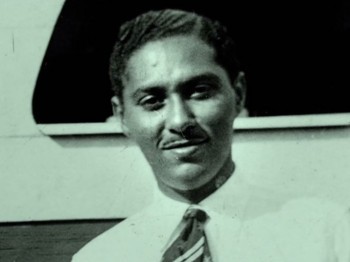 Black and white photo of a man smiling