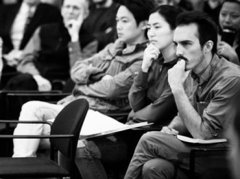 People listen attentively to a presentation.