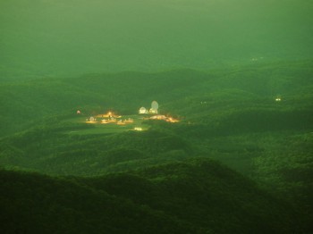 Large round structures and lights in a field in the middle of a forest