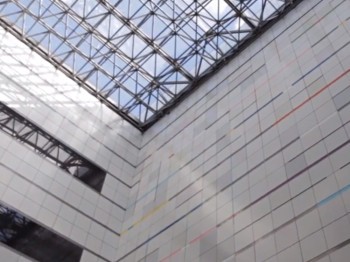 Still from the Council for the Arts at MIT 40th Anniversary Commemorative Video showing the walls and ceiling of the Weisner building.