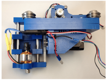 A mechanical and electric device made of blue plastic, wires, and gears.