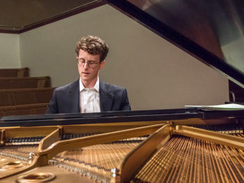 A student plays piano.