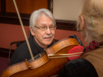 John Harbison looks at a violinist.