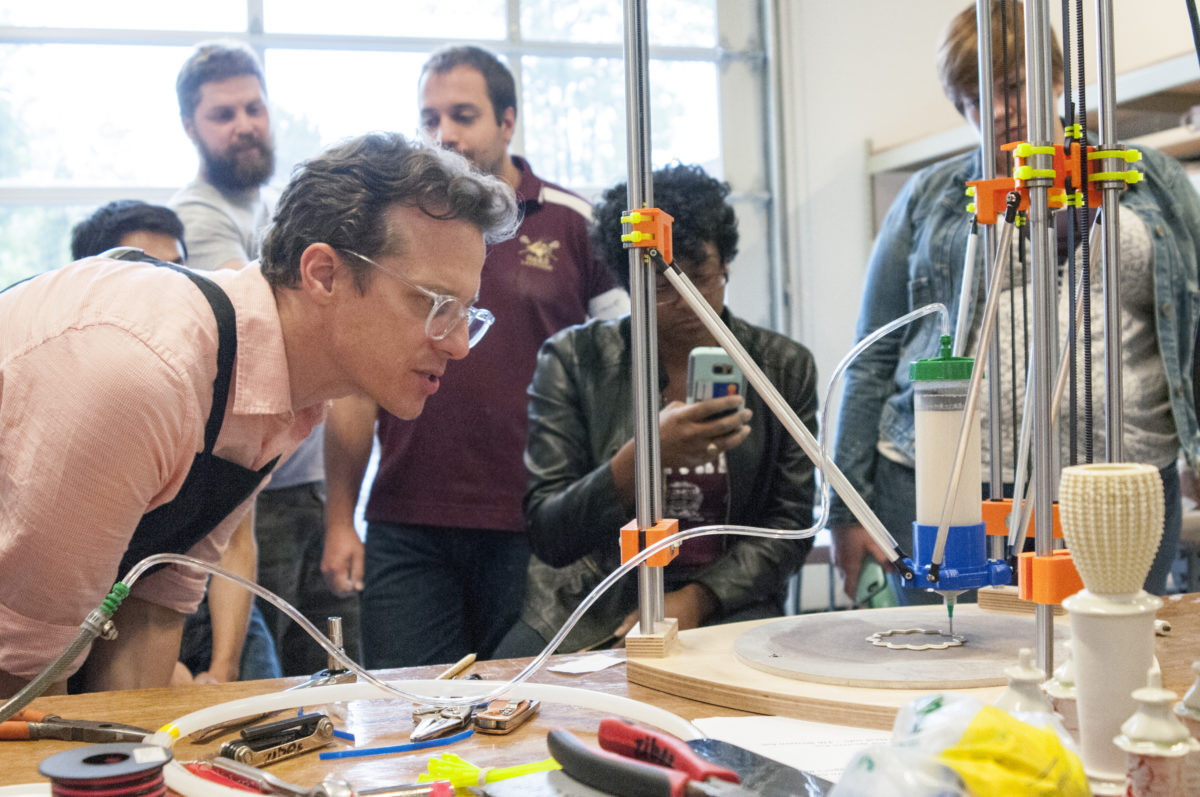 Bryan Czibesz and students observing 3D printer in action. Credit: Jay Pastorello.