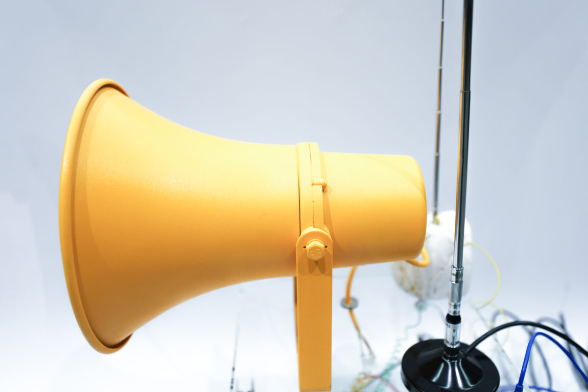 Close up of sculpture by Nicole L'Huillier shows yellow megaphone and antana.