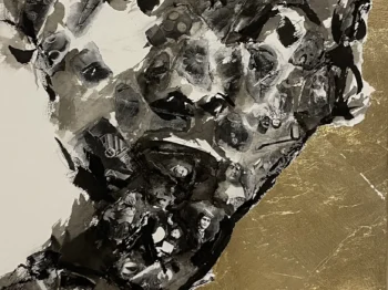 A black and white ink drawing of a face with many small black and white images collaged within the face. To the right of the face, the paper is covered in gold leaf.