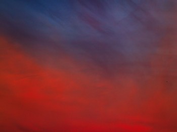 A blue and red cloudy sky.